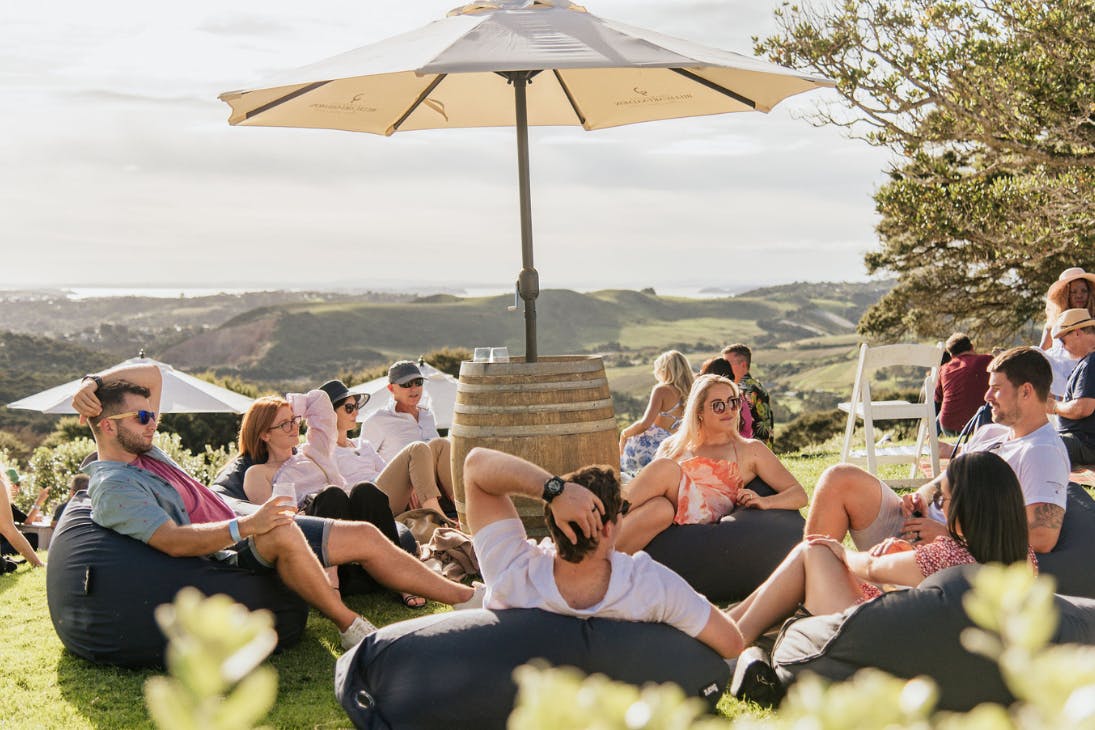 People sitting on beanbag lawns at an Auckland winery